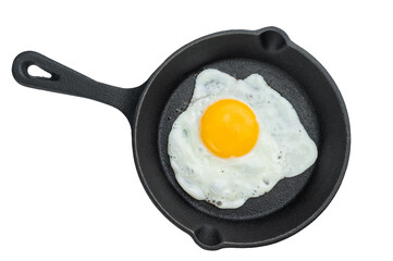 Hot fried egg with bright yolk in cast iron skillet. Crisp edges and clean minimal style perfect for breakfast food themes.