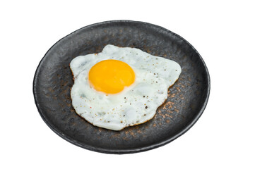 Bright yolk fried egg with light seasoning on rustic plate, clean overhead shot perfect for breakfast, recipe and nutrition concepts.