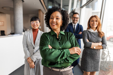 Obraz premium Confident Business Team Posing in Modern Office Environment