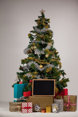 Blank slate with presents and christmas tree