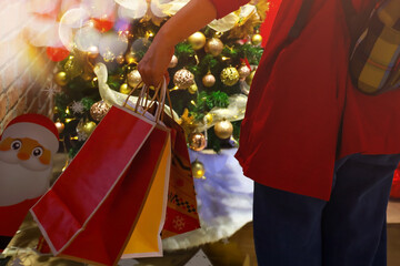 Woman hand pick up of the colorfull of shopping bag at the store retail	