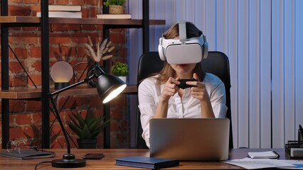 Woman Engaged in Virtual Reality Gaming at Desk