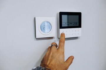 User interacts with touch interface on modern HVAC digital device