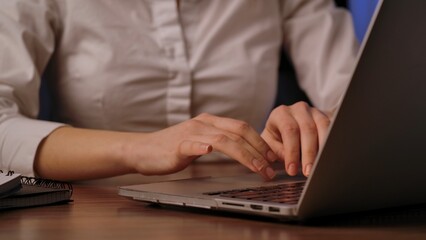 Close Up of Hands Typing on Laptop Keyboard