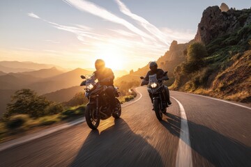 Dynamic duo on motorcycles navigating curves through a sunlit landscape
