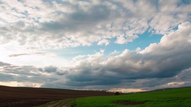 Clouds rolling above fields, time lapse