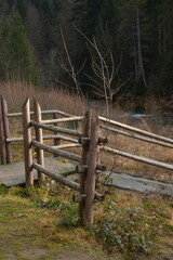 Old wooden railings and a fence near a mountain river