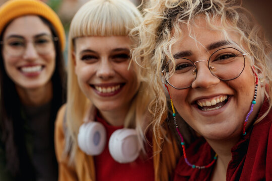 Young diverse women taking selfie, smiling, and having fun - Powered by Adobe