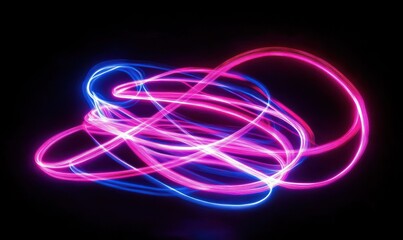 Colorful light trails form abstract shapes on a black background.