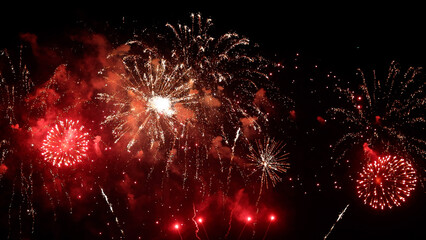 Amazing real beautiful colorful fireworks background on celebration night event for happy new year party, Abstract Multi color golden firework in the night sky