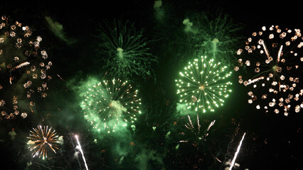 Amazing real beautiful colorful fireworks background on celebration night event for happy new year party, Abstract Multi color golden firework in the night sky