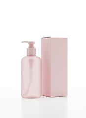 Elegant Skincare: A minimalist setup highlights a stylish, pink lotion dispenser alongside a matching product box, creating a sense of luxury and wellness.