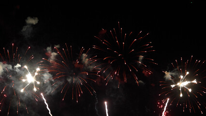 Amazing real beautiful colorful fireworks background on celebration night event for happy new year party, Abstract Multi color golden firework in the night sky