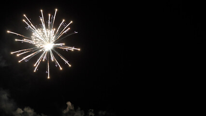 Amazing real beautiful colorful fireworks background on celebration night event for happy new year party, Abstract Multi color golden firework in the night sky