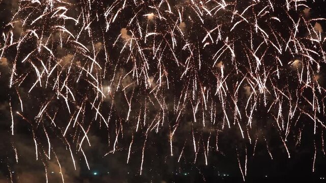 Amazing real beautiful colorful fireworks background on celebration night event for happy new year party, Abstract Multi color golden firework in the night sky