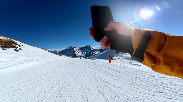 Skier point of view recording a descent with a smartphone