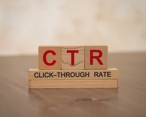 CTR click-through rate concept with wooden blocks and printed text on wooden surface for digital marketing