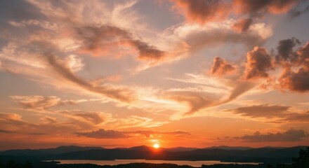 Fototapeta premium Vibrant Sunset Over Calm Lake with Dramatic Cloud Formations.