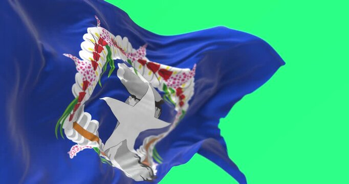 Close-up of Northern Mariana Islands flag waving isolated on green background