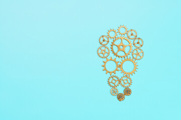 Innovation and creative thinking concept with golden gear lightbulb