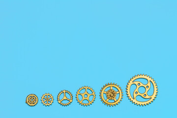 Efficiency and optimization concept with gold gears in linear layout