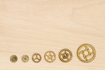 Growth and progress concept with gold gears arranged in ascending order