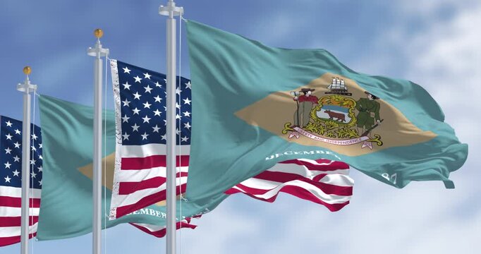 Delaware state flag waving with the national american fla