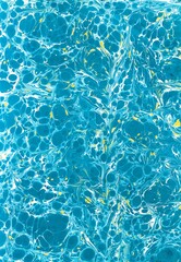 Traditional Turkish ebru marbling art with turquoise blue and gold patterns. Abstract water marble texture background for modern design, web, print and decoration.