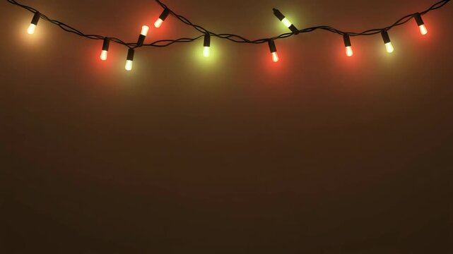 A string of colorful Christmas lights on a dark brown wall, viewed from below, on a festive holiday occasion, displaying red, green, and yellow lights.