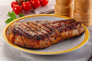 Grilled pork steak with bone