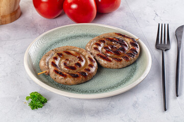 Grilled beef round circle sausages
