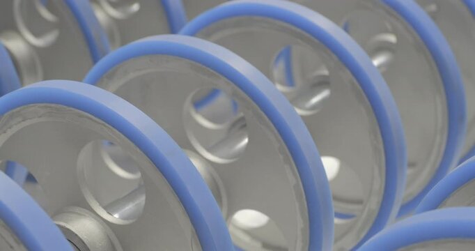 The conveyor is working, the rollers are rotating. Handheld shot, real time speed, artificial lighting.