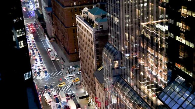 NEW YORK CITY - DECEMBER 2018: Aerial overhead view of Manhattan night traffic and firefighters truck in slow motion, New York City, USA