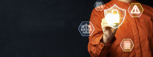 Person hand interacting with a virtual shield icon with a padlock, representing data protection and security, surrounded by legal and compliance icons. Concept of Data Privacy Enforcement