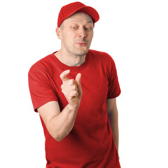 A man in a red shirt and red cap makes a hand gesture to indicate something small while smiling