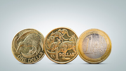 New Zealand and Australian Dollar Coins Next to Euro Coin