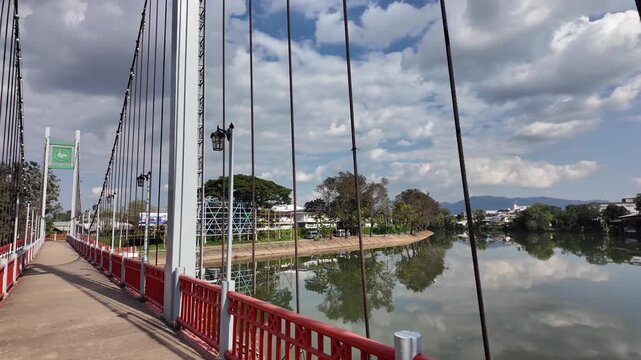 Walking at the Suspension bridge over the Wang river in Lampang Thailand