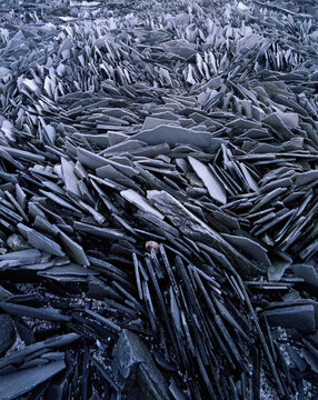 Full frame of gray colored broken tiles