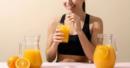 Happy Woman Drinking Fresh Orange Juice for Health and Wellness