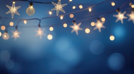 Fototapeta premium Warm string lights glow against a soft, blurred blue backdrop, creating a cozy, festive, and magical winter scene. Christmas, happy New Year decoration.