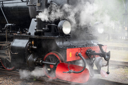 Old steam train on railway track