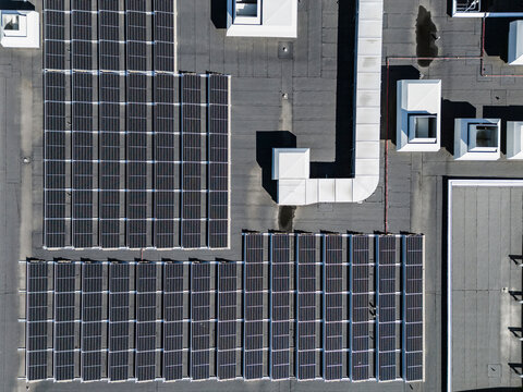 Aerial view of solar panels on top of building terrace