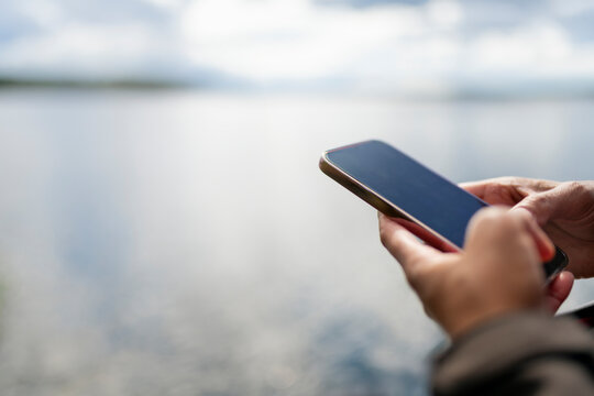 Close-up of unrecognizable person using smart phone