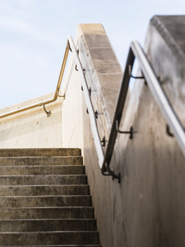 View of steps with railing mounted on retaining wall