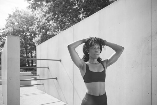 Tired female athlete working out at park