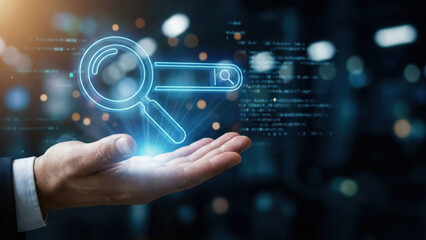 Fototapeta premium Digital search concept with magnifying glass icon glowing above hand, technology innovation and data analysis in business
