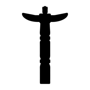 Detailed silhouette of a Native American totem pole with wings outstretched