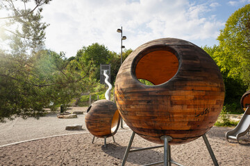 Empty wooden sphere at sunny day in playground