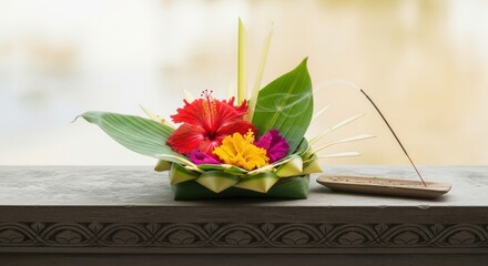A vibrant arrangement of tropical flowers and greenery, elegantly displayed in a woven basket, accompanied by incense, set against a serene water backdrop, evoking tranquility and harmony