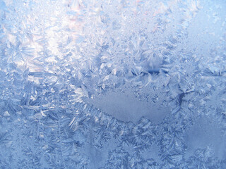 Beautiful ice pattern on window glass, natural winter background